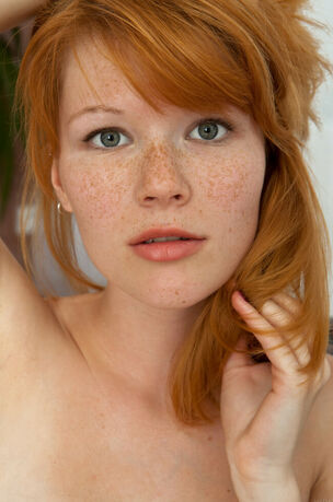 Redheaded young with ultra-cute..